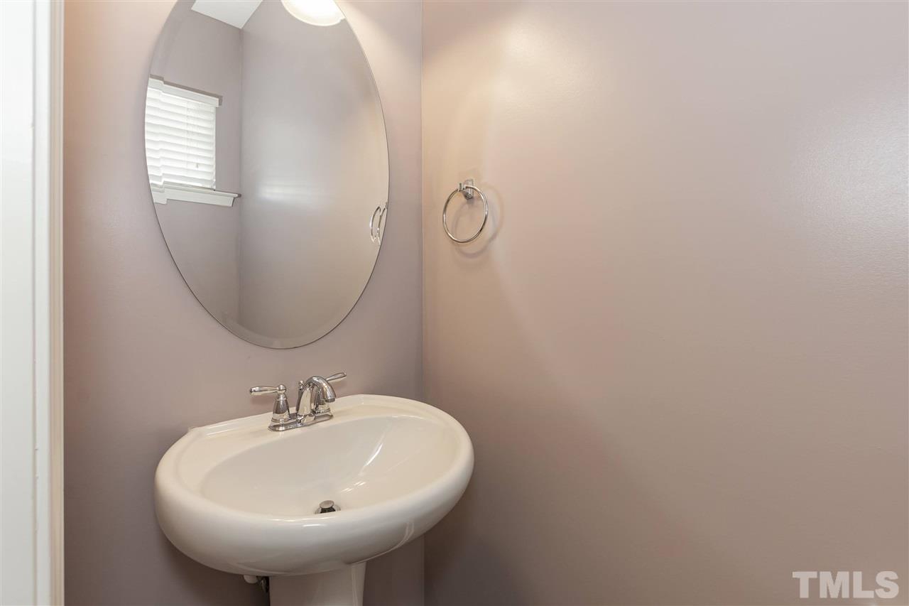 943 Consortium Drive Raleigh, NC 27603 - Photo 14 of 29 a bathroom with a sink and a mirror