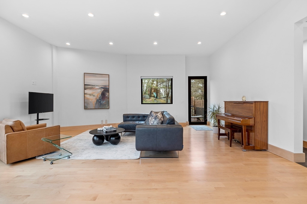 71 Grove Street Brookline, MA 02467 - Photo 11 of 42 a living room with furniture and a flat screen tv