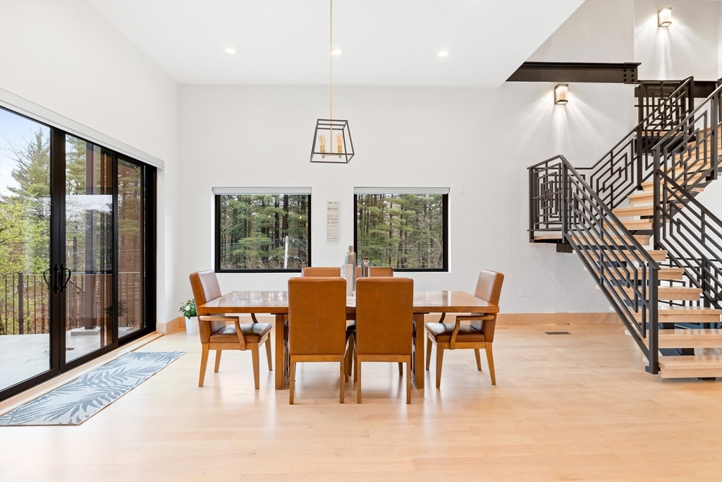71 Grove Street Brookline, MA 02467 - Photo 14 of 42 a dining room with furniture and wooden floor