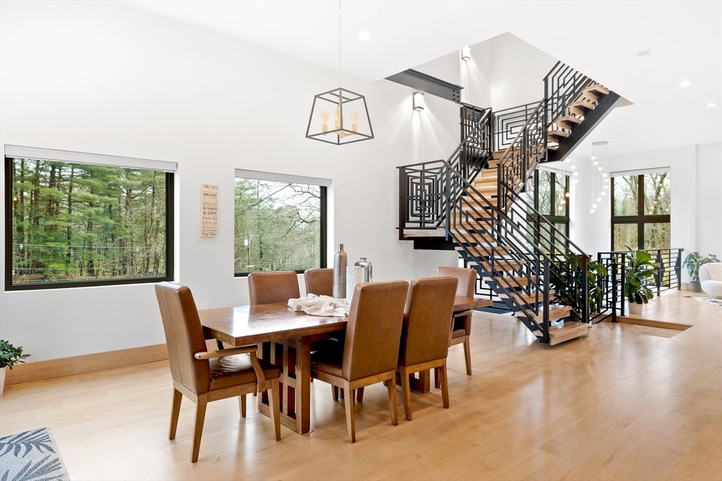 71 Grove Street Brookline, MA 02467 - Photo 15 of 42 a dining room with furniture entryway and wooden floor