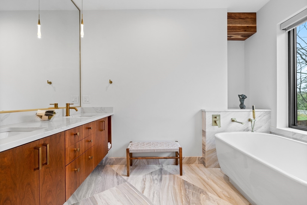 71 Grove Street Brookline, MA 02467 - Photo 26 of 42 a bathroom with a sink and a bathtub