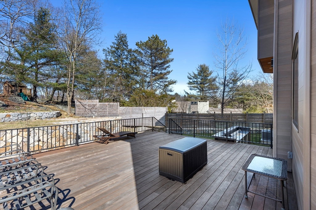 71 Grove Street Brookline, MA 02467 - Photo 40 of 42 a view of a terrace with wooden floor and outdoor seating
