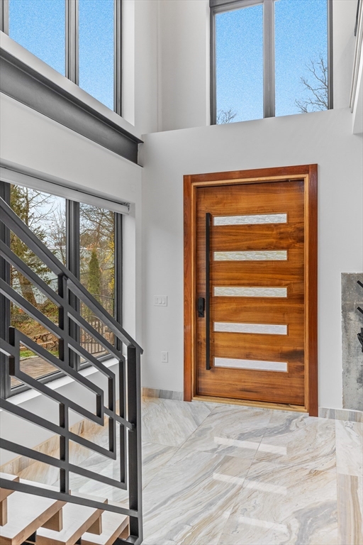 71 Grove Street Brookline, MA 02467 - Photo 4 of 42 a view of walk in closet with empty racks