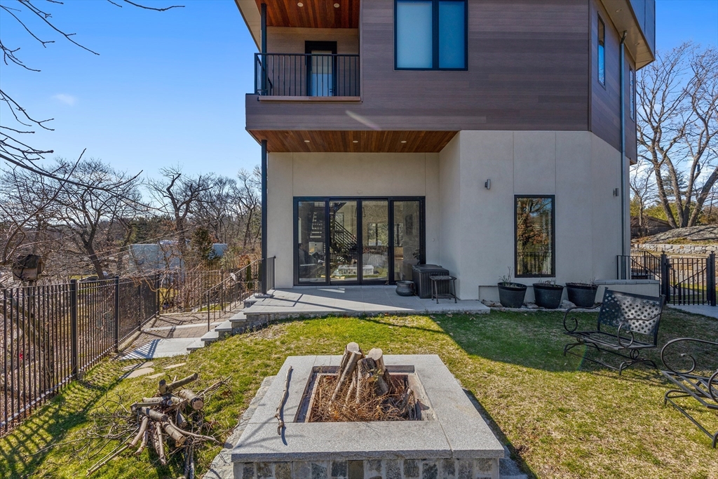 71 Grove Street Brookline, MA 02467 - Photo 41 of 42 a view of a house with swimming pool