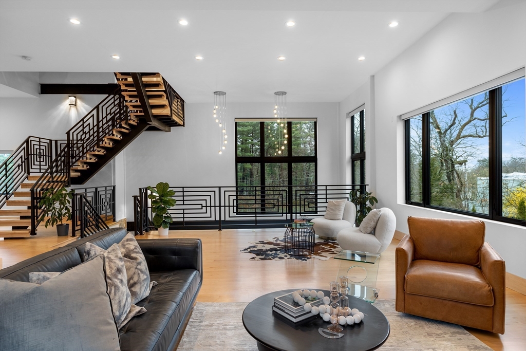 71 Grove Street Brookline, MA 02467 - Photo 6 of 42 a living room with furniture and a large window
