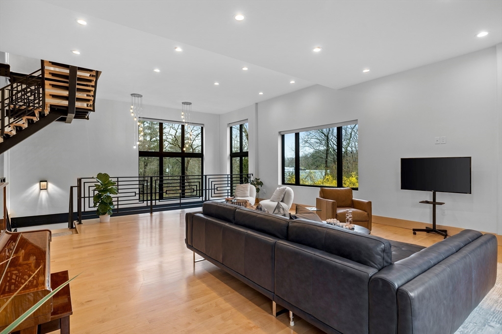 71 Grove Street Brookline, MA 02467 - Photo 7 of 42 a living room with furniture and a flat screen tv