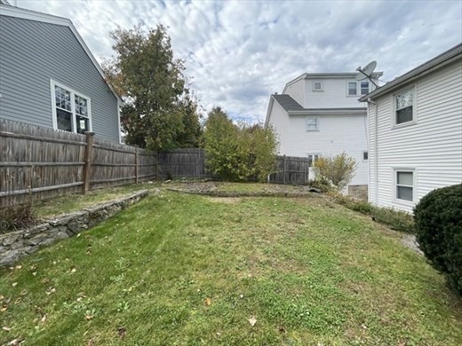 59 Desoto Road, Unit 2 Boston, MA 02132 - Photo 12 of 13 a view of a backyard with a large tree