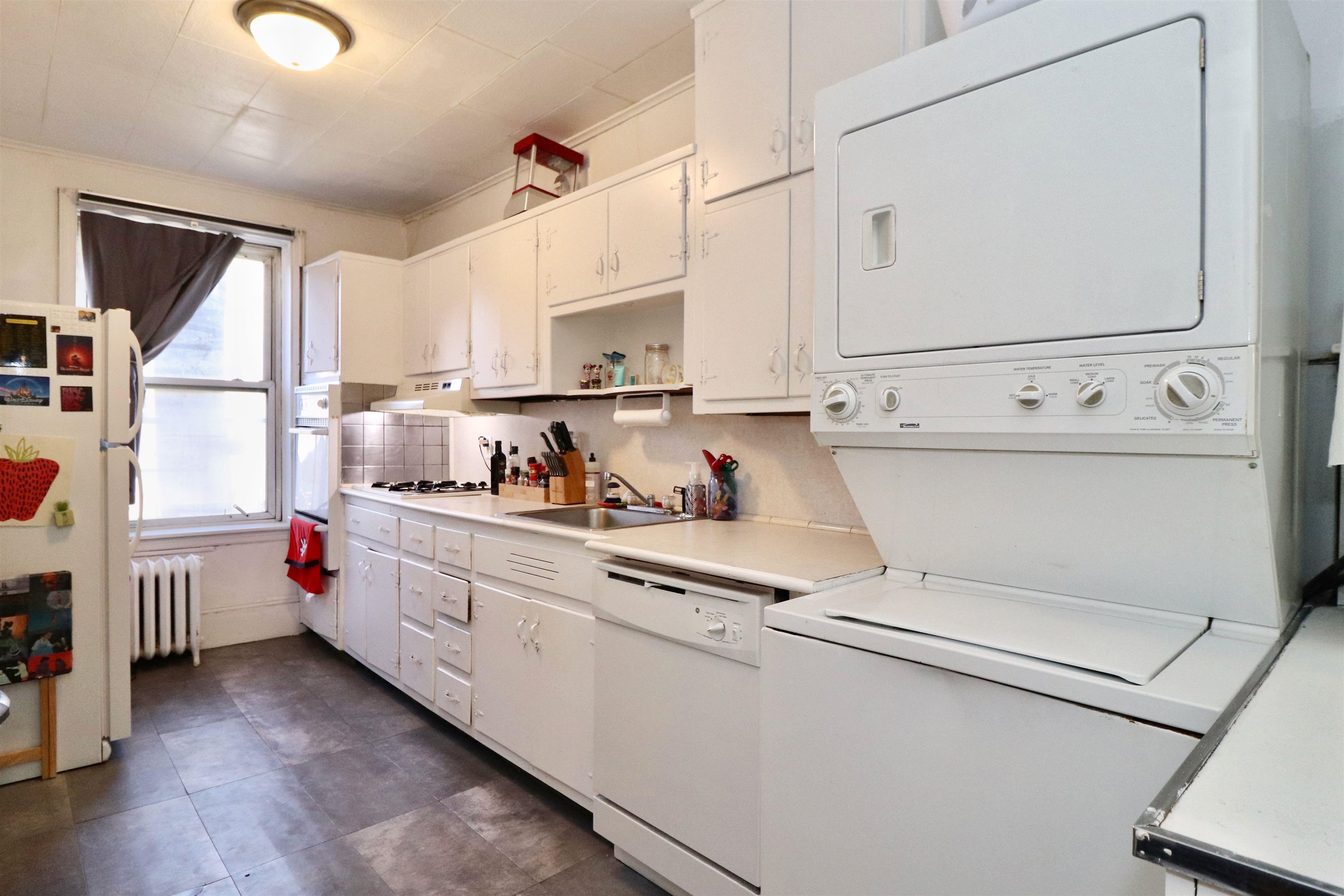 704 Washington Street, Unit 2 Hoboken, NJ 07030 - Photo 1 of 23 a kitchen with stainless steel appliances a white cabinets and a sink