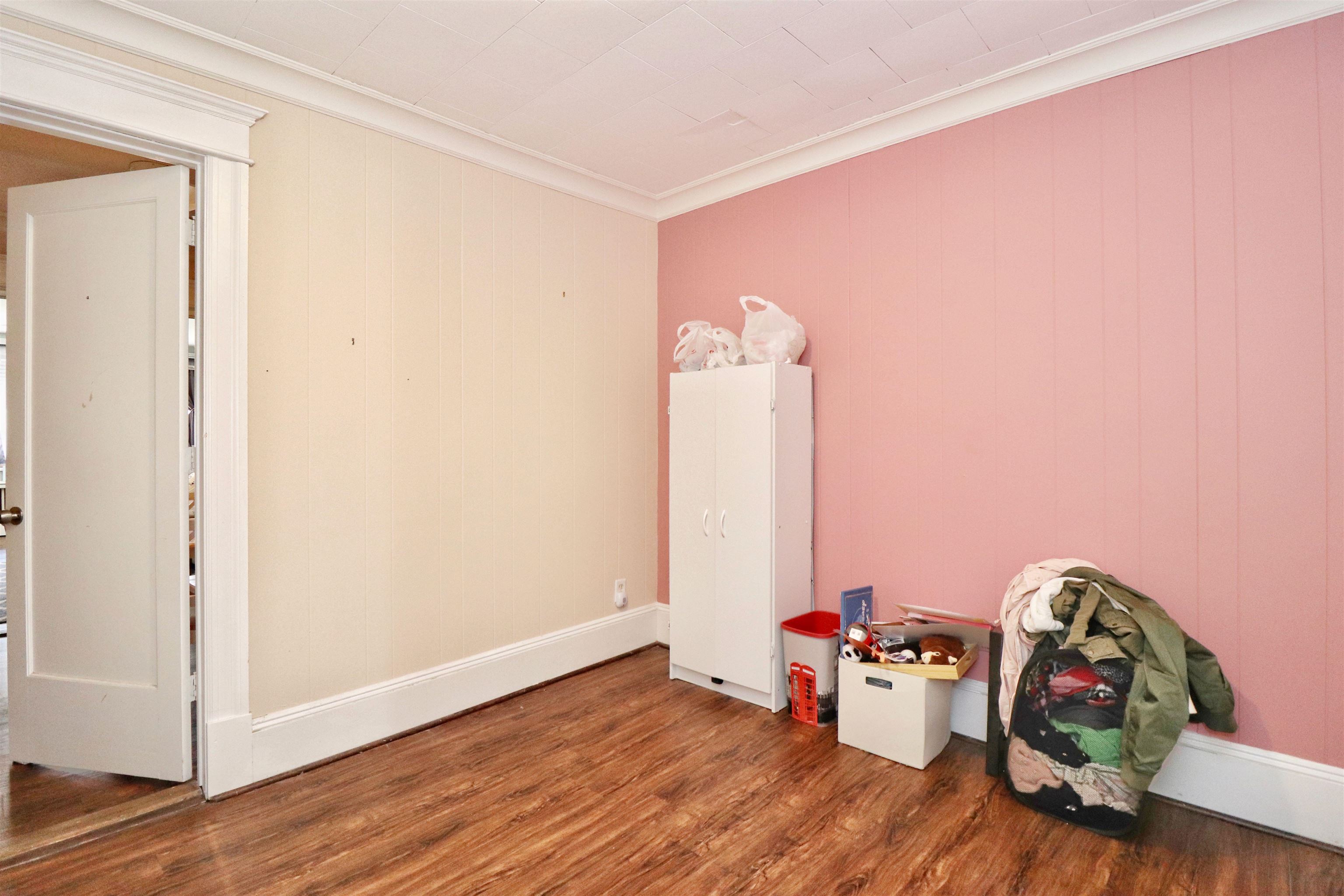 704 Washington Street, Unit 2 Hoboken, NJ 07030 - Photo 13 of 23 a view of a room with wooden floor and closet