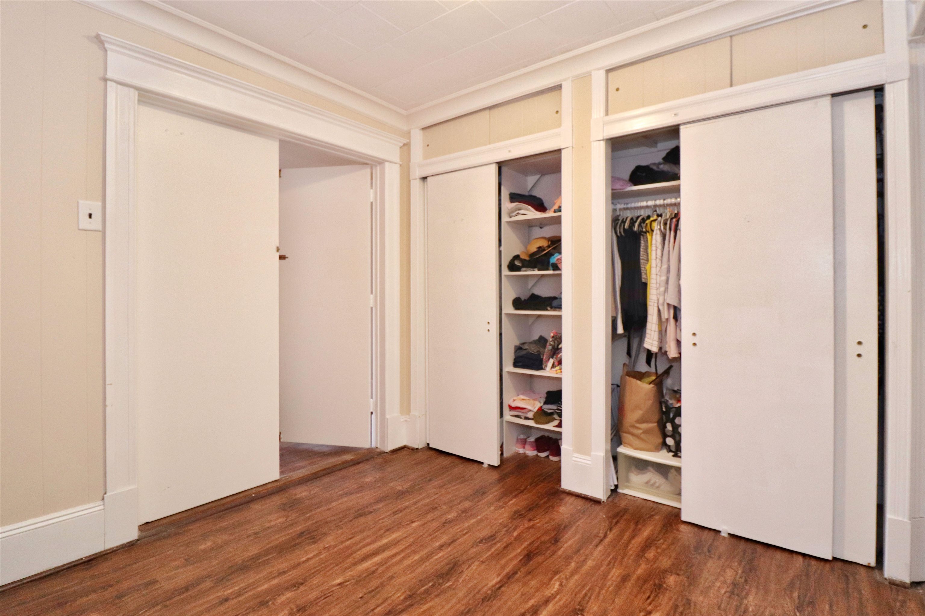 704 Washington Street, Unit 2 Hoboken, NJ 07030 - Photo 15 of 23 an empty room with wooden floor and closet