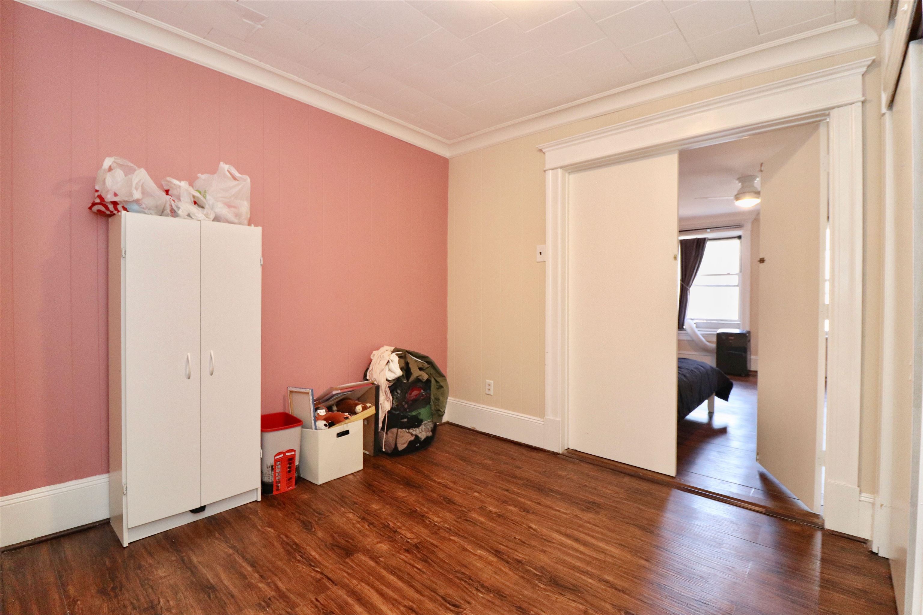 704 Washington Street, Unit 2 Hoboken, NJ 07030 - Photo 16 of 23 a view of a room with wooden floor and stairs