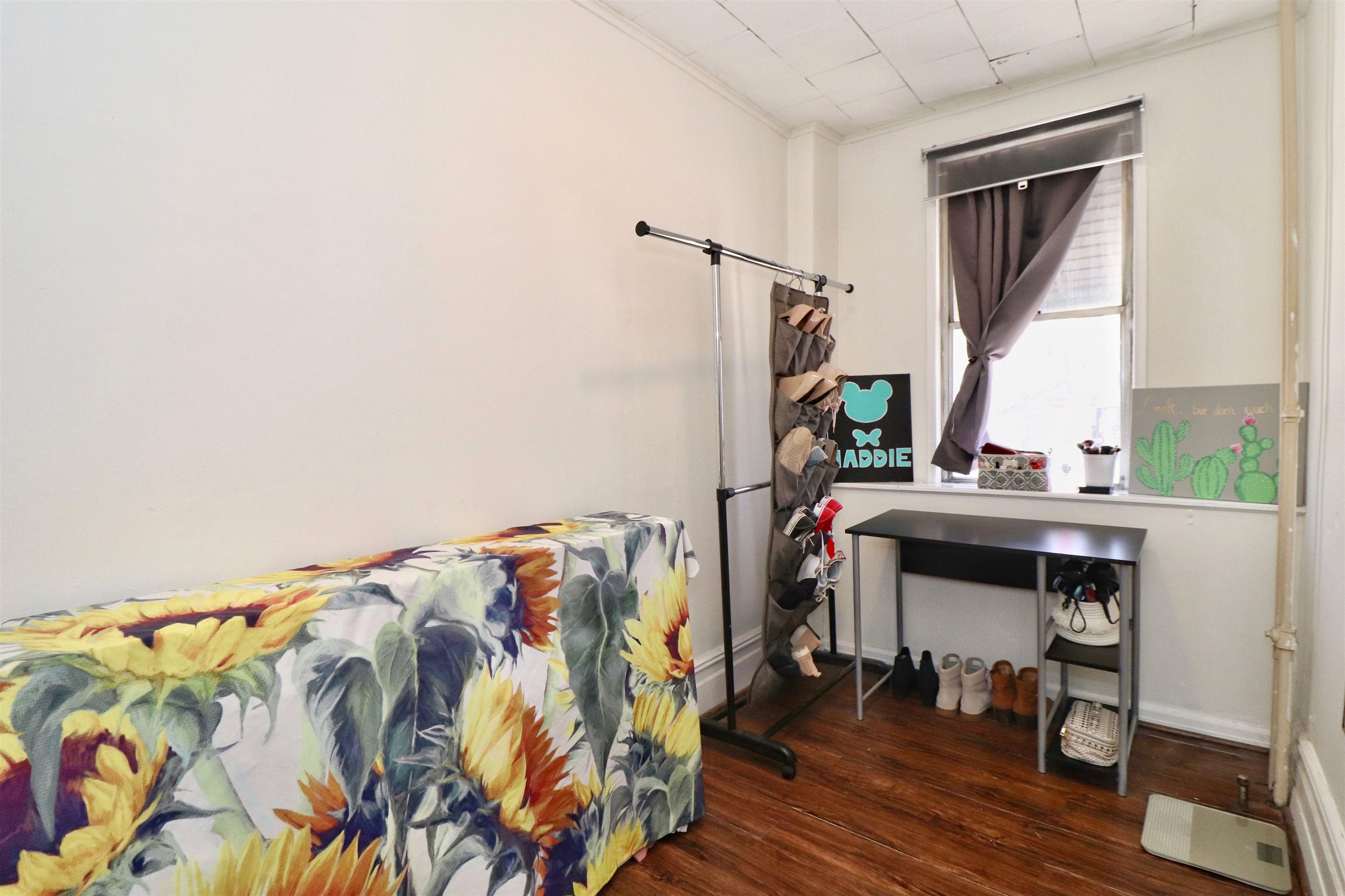 704 Washington Street, Unit 2 Hoboken, NJ 07030 - Photo 17 of 23 a bedroom with a bed and a table