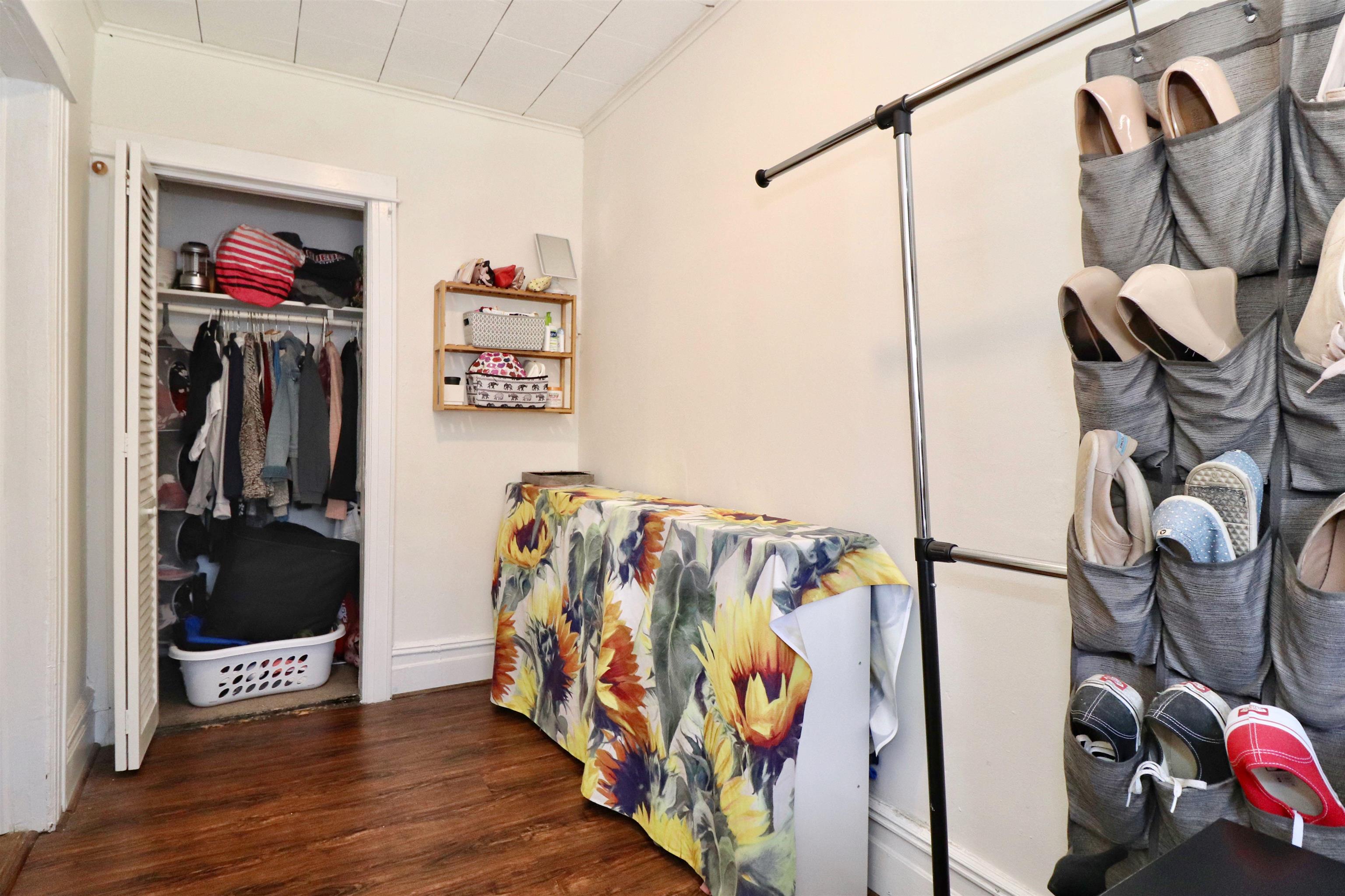 704 Washington Street, Unit 2 Hoboken, NJ 07030 - Photo 18 of 23 a view of walk in closet with clothes and shoes