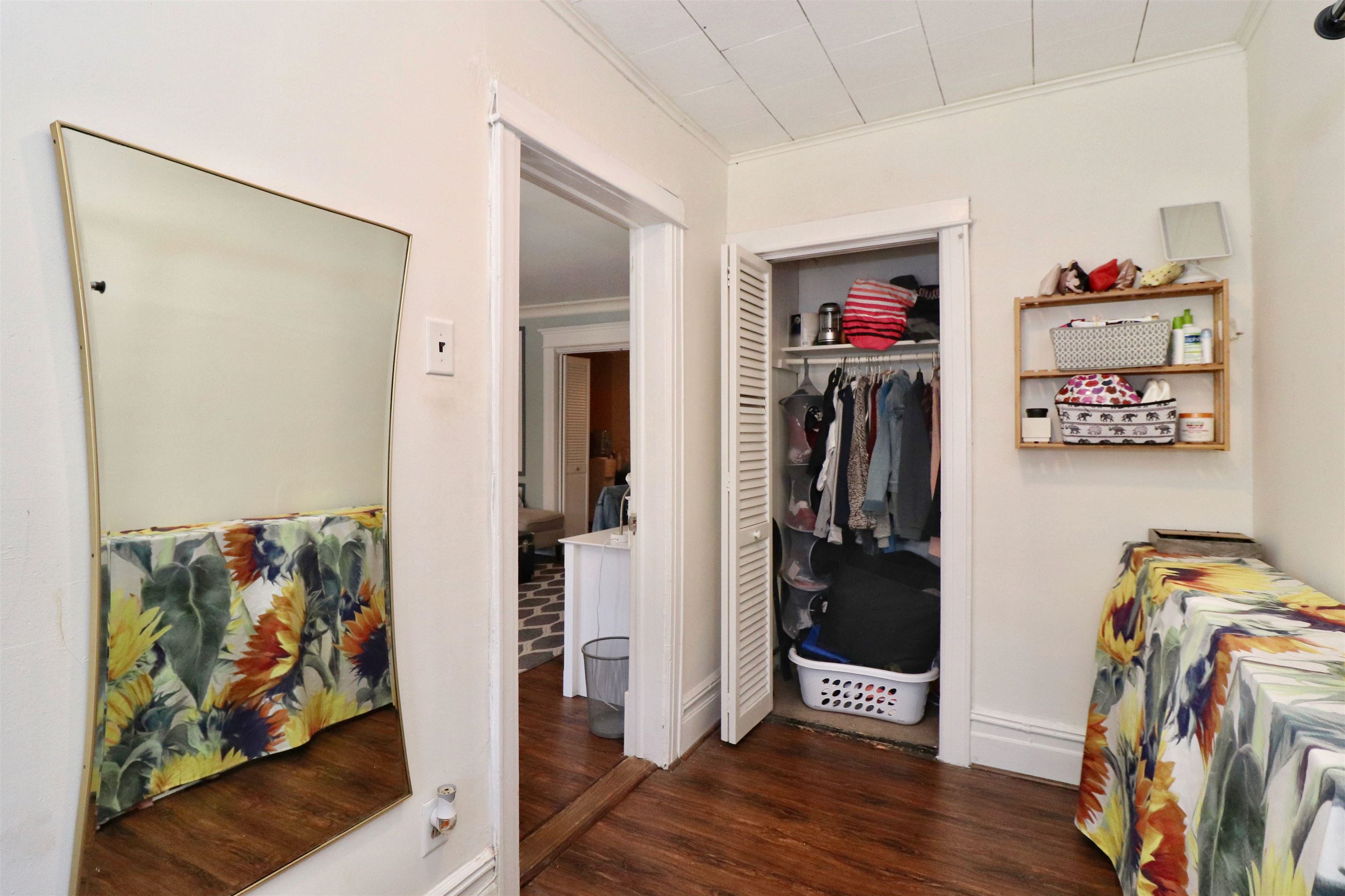 704 Washington Street, Unit 2 Hoboken, NJ 07030 - Photo 19 of 23 a view of a hallway with wooden floor and closet