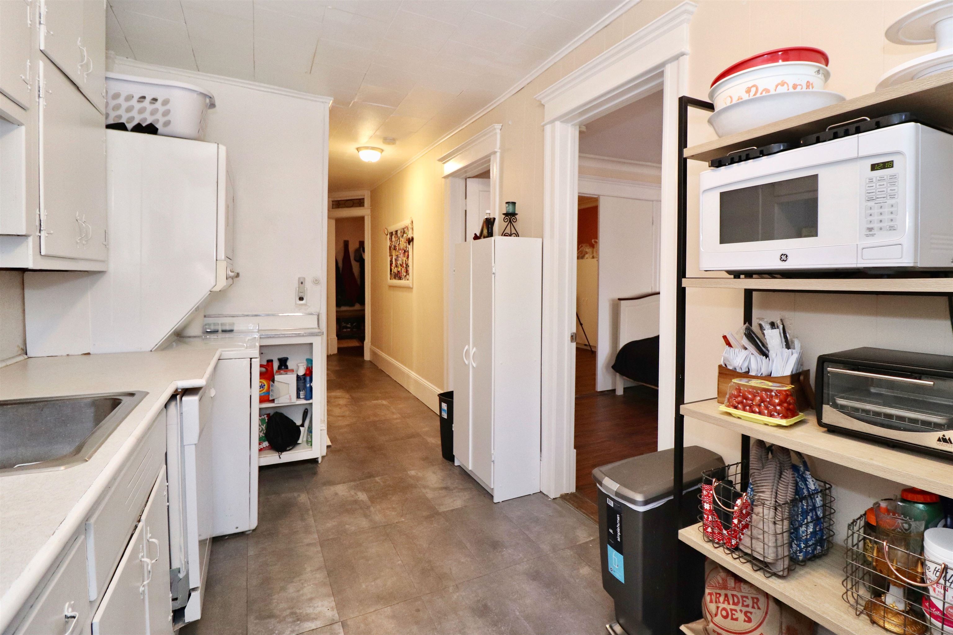 704 Washington Street, Unit 2 Hoboken, NJ 07030 - Photo 3 of 23 a kitchen with stainless steel appliances granite countertop a refrigerator and a stove top oven
