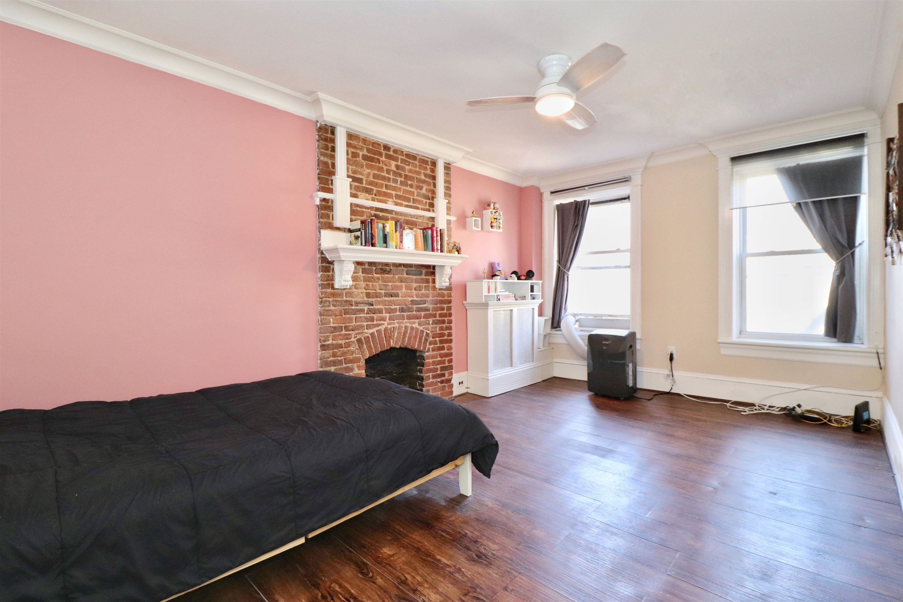 704 Washington Street, Unit 2 Hoboken, NJ 07030 - Photo 8 of 23 a living room with furniture and a fireplace