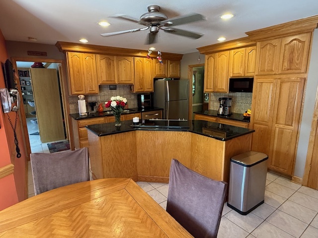 1201 East Street Crete, IL 60417 - Photo 17 of 45 a view of a living room with furniture and a flat screen tv