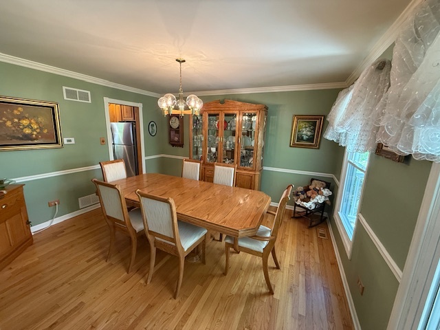 1201 East Street Crete, IL 60417 - Photo 20 of 45 a view of a dining room with furniture and wooden floor