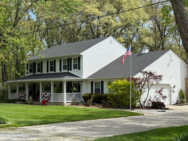 1201 East Street Crete, IL 60417 - Photo 2 of 45 a front view of a house with a yard