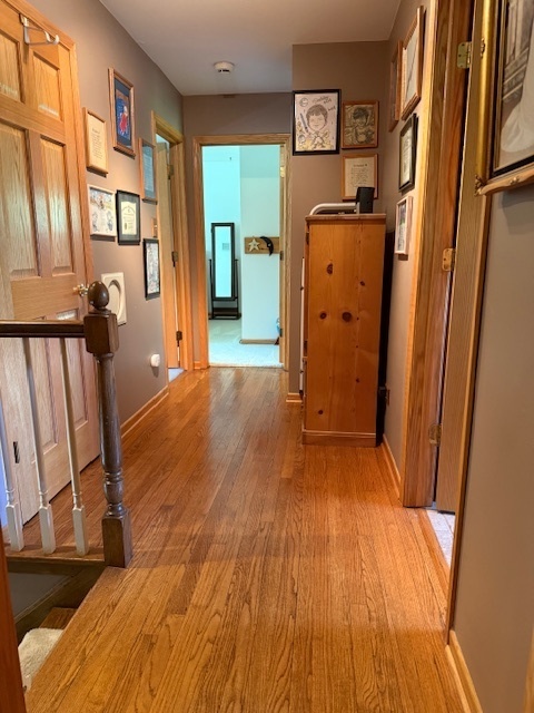 1201 East Street Crete, IL 60417 - Photo 26 of 45 a view of a room with wooden floor and stairs