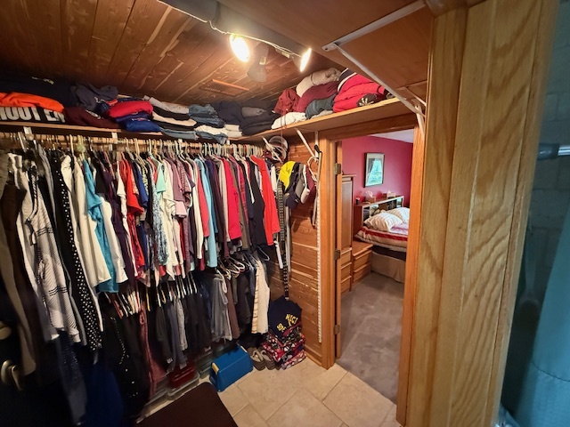1201 East Street Crete, IL 60417 - Photo 32 of 45 a view of walk in closet with clothes