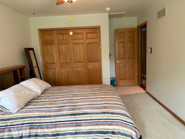 1201 East Street Crete, IL 60417 - Photo 38 of 45 a bedroom with a bed and wooden floor