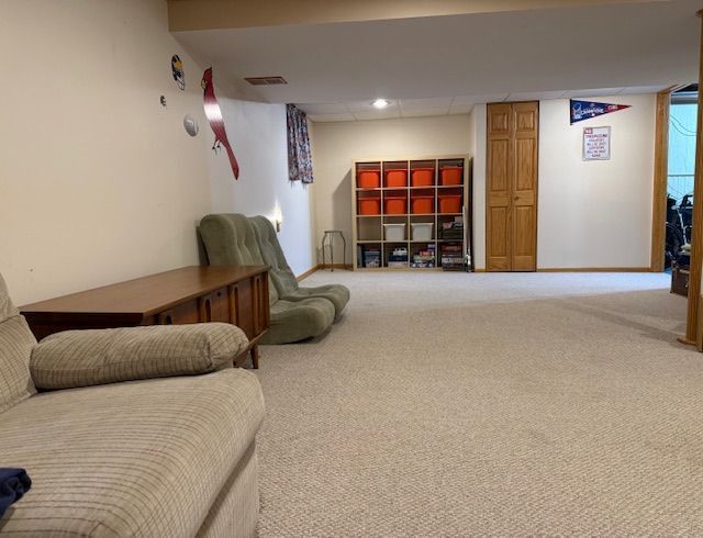 1201 East Street Crete, IL 60417 - Photo 42 of 45 a living room with furniture a flat screen tv and a lamp