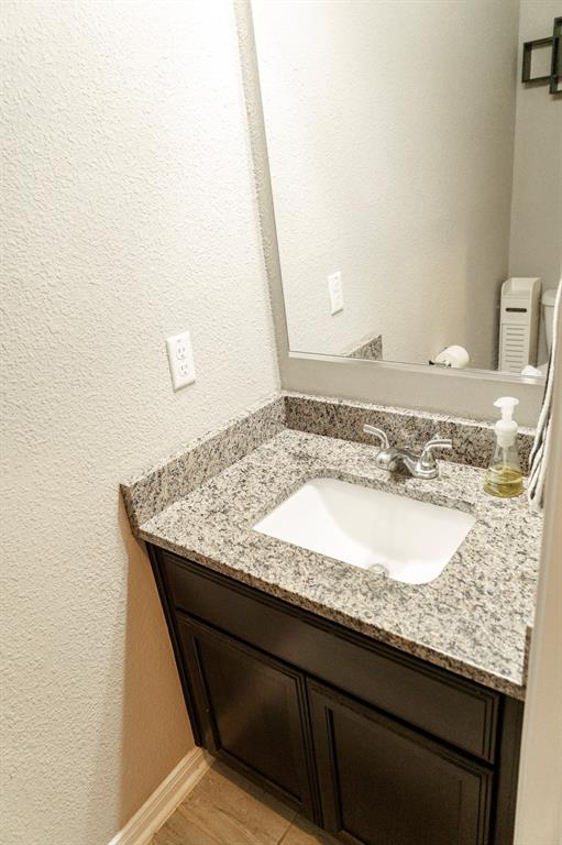 2716 Beutel Road Lorena, TX 76655 - Photo 38 of 39 a bathroom with a granite countertop sink and a granite