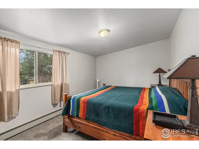 a bedroom with a bed and a view of bathroom