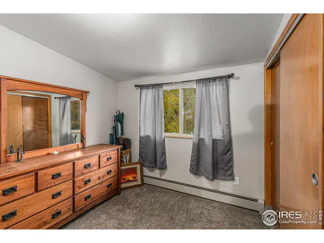 a room with mirror and window