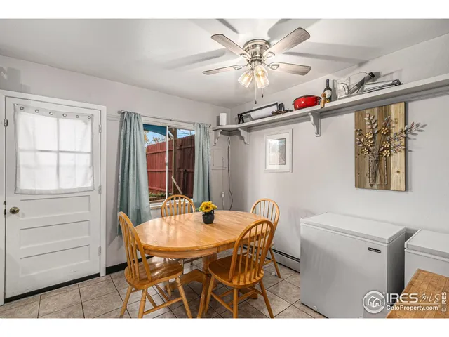 a view of a dining room with furniture and window