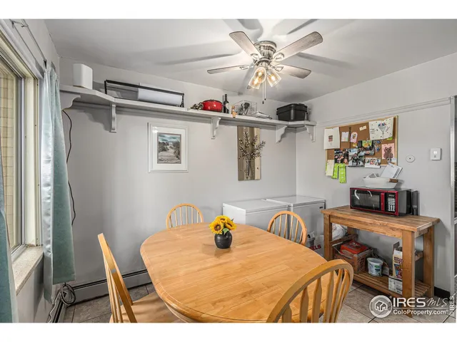 a dining room with furniture and chandelier