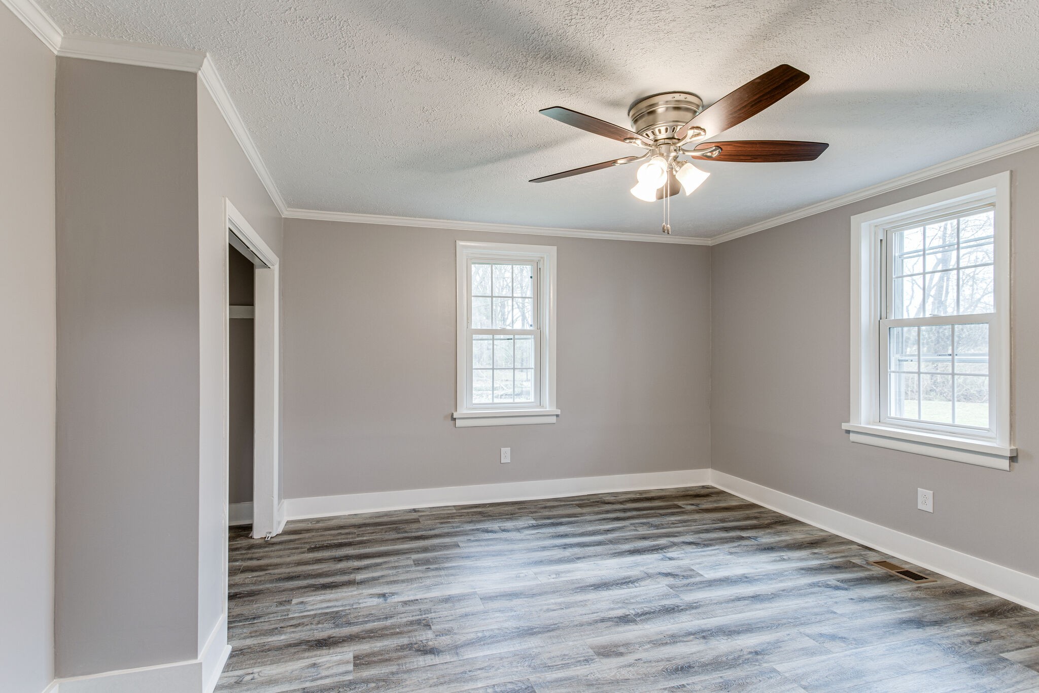 1466 Bible Crossing Road Winchester, TN 37398 - Photo 20 of 31 a view of an empty room with wooden floor and a window