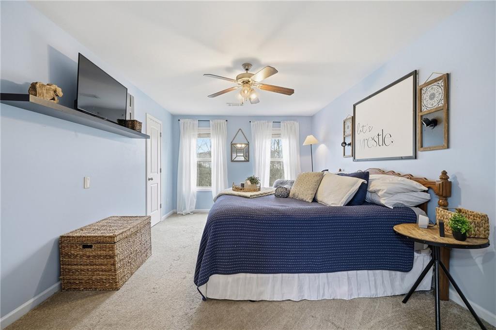 615 Myers Gate Road Ball Ground, GA 30107 - Photo 23 of 43 a bedroom with a bed and dresser