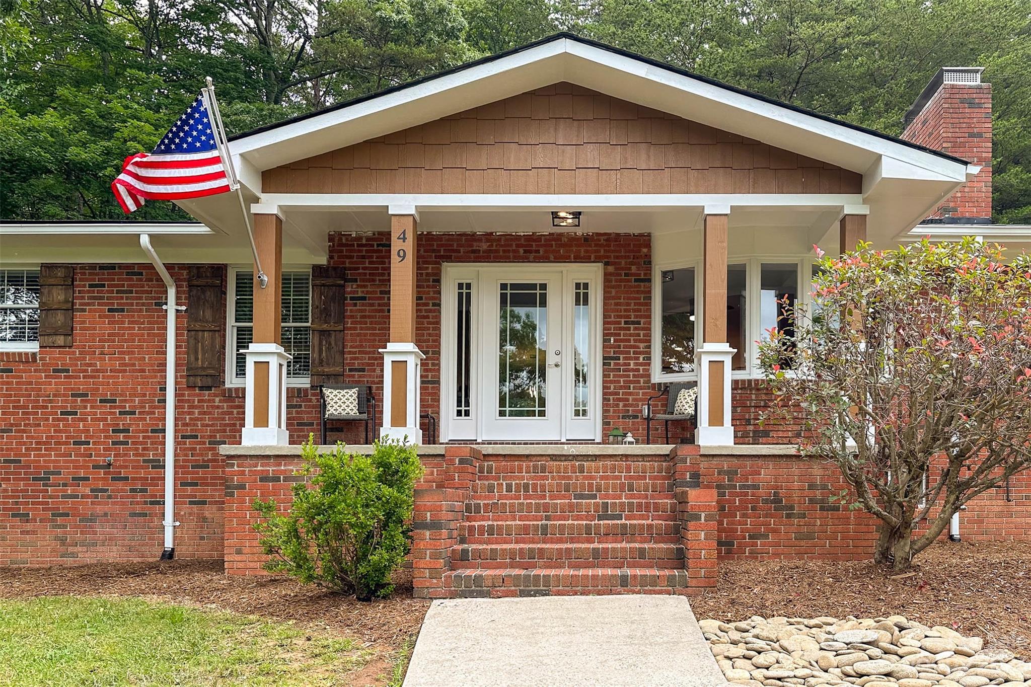 49 Community Road Fletcher, NC 28732 - Photo 1 of 38 a front view of a house with porch