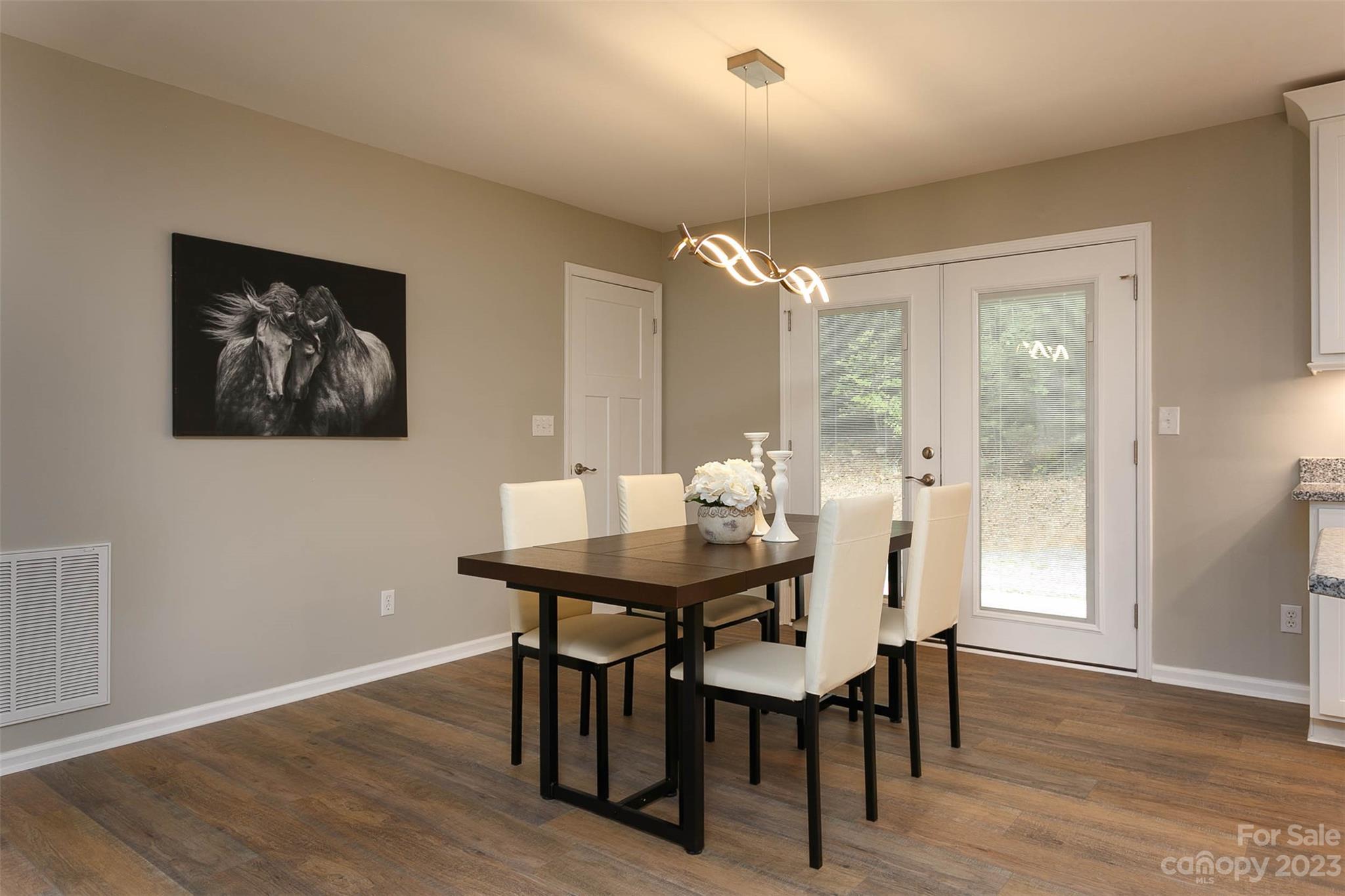 49 Community Road Fletcher, NC 28732 - Photo 12 of 38 a view of a dining room with furniture window and wooden floor