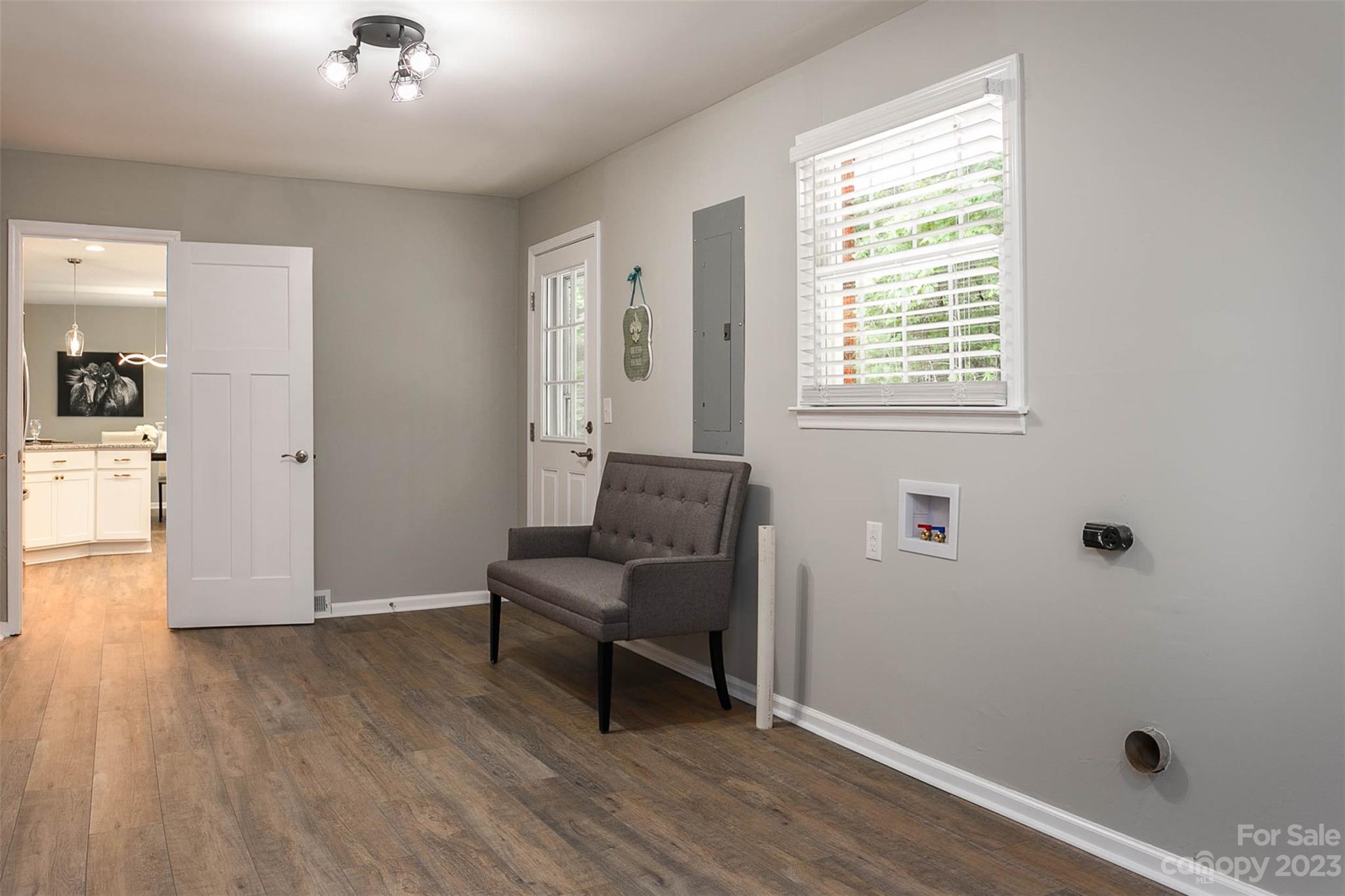 49 Community Road Fletcher, NC 28732 - Photo 24 of 38 wooden floor in an empty room with a window