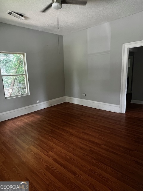 2033 3rd Avenue Macon, GA 31204 - Photo 2 of 12 an empty room with wooden floor and windows