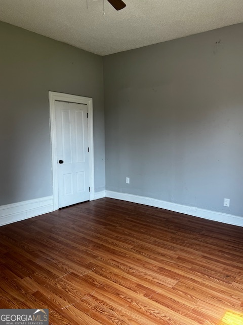 2033 3rd Avenue Macon, GA 31204 - Photo 5 of 12 a view of an empty room with wooden floor