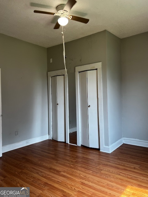 2033 3rd Avenue Macon, GA 31204 - Photo 8 of 12 a view of empty room with wooden floor and fan