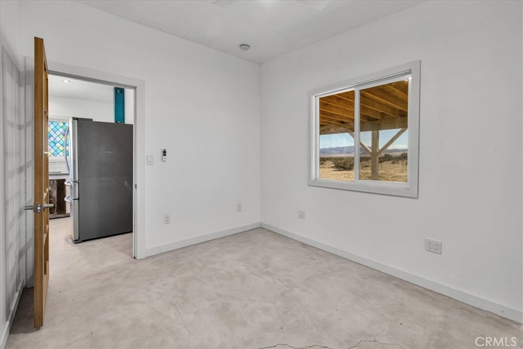 86515 Amboy Road Twentynine Palms, CA 92277 - Photo 14 of 34 an empty room with windows and closet