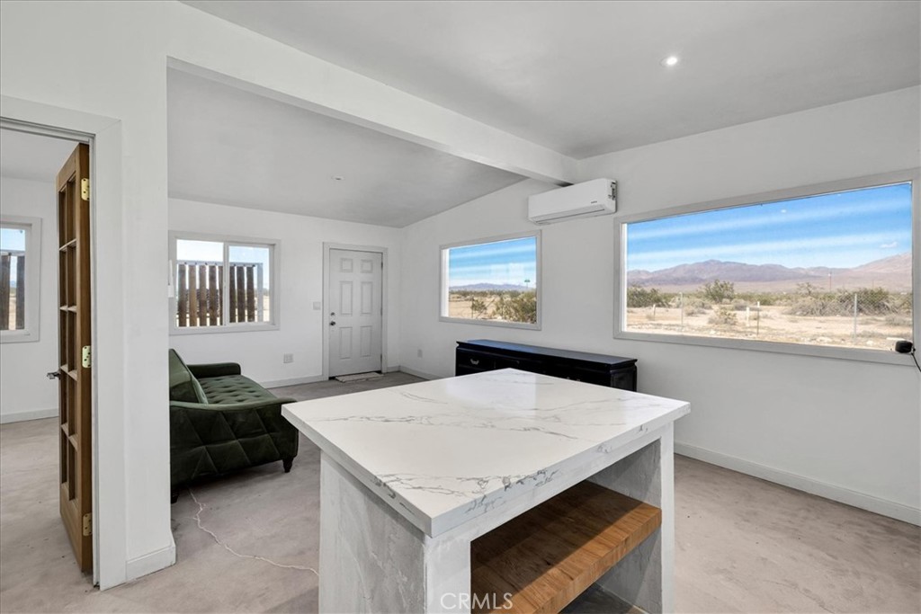 86515 Amboy Road Twentynine Palms, CA 92277 - Photo 14 of 35 a kitchen with a table chairs and window