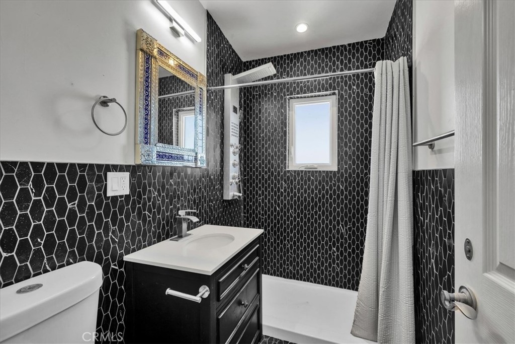 86515 Amboy Road Twentynine Palms, CA 92277 - Photo 15 of 34 a bathroom with a sink a toilet and shower