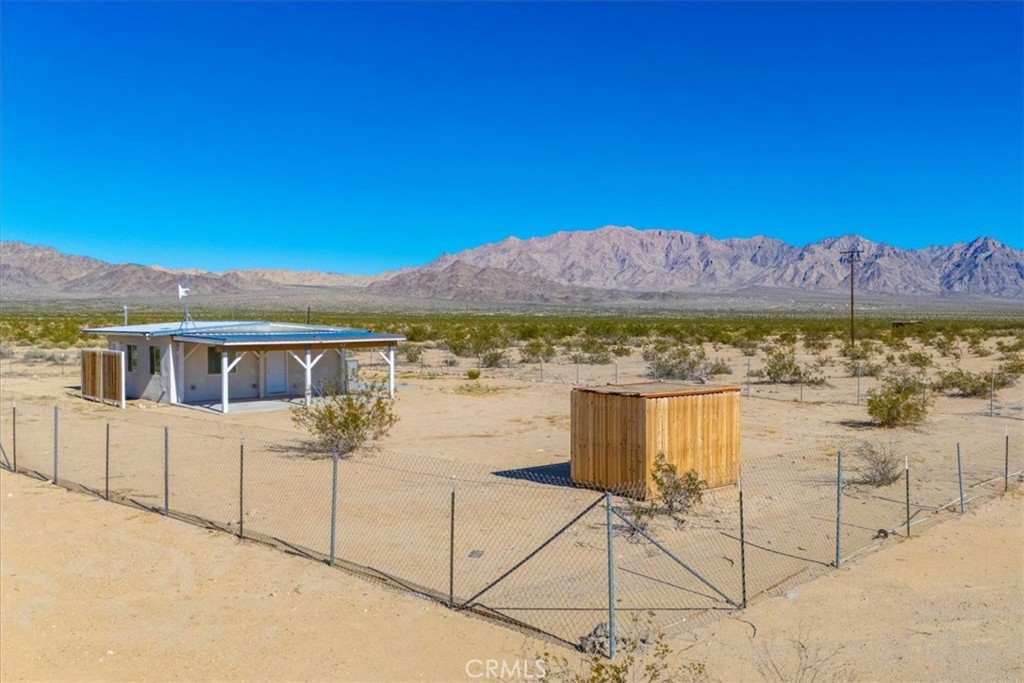 86515 Amboy Road Twentynine Palms, CA 92277 - Photo 23 of 35 a view of a terrace with a table and chairs