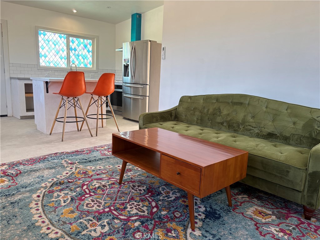 86515 Amboy Road Twentynine Palms, CA 92277 - Photo 5 of 34 a living room with furniture and a rug