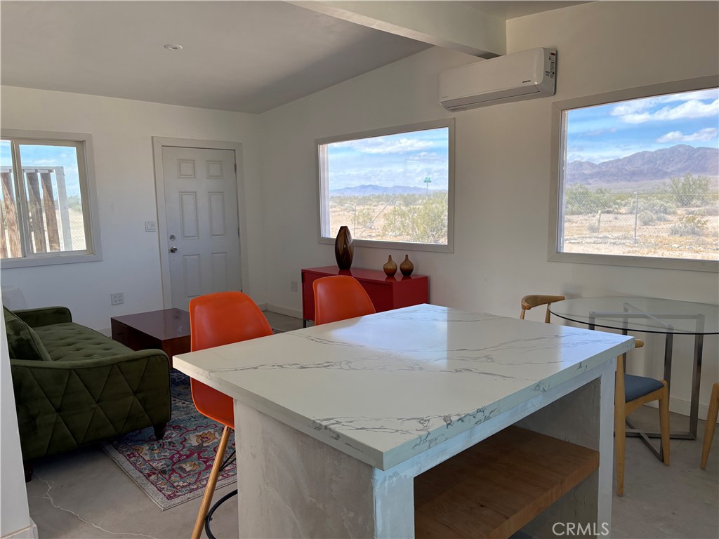 86515 Amboy Road Twentynine Palms, CA 92277 - Photo 6 of 34 a view of a dining room with furniture and window