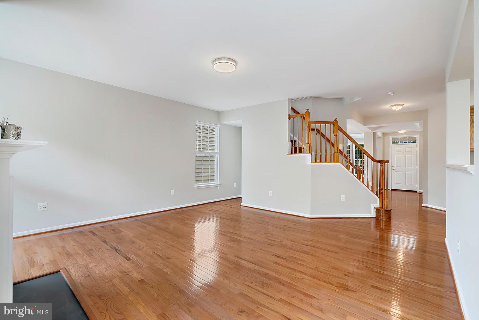 4175 Bell Ridge Court Chantilly, VA 20151 - Photo 18 of 48 a view of a livingroom with wooden floor and stairs