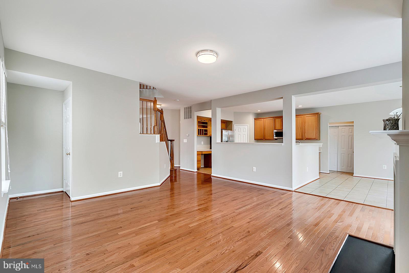 4175 Bell Ridge Court Chantilly, VA 20151 - Photo 19 of 48 a view of a big room with wooden floor and kitchen