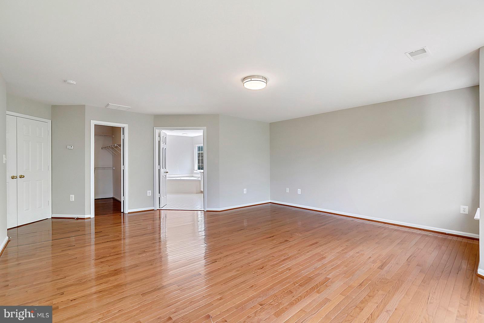 4175 Bell Ridge Court Chantilly, VA 20151 - Photo 23 of 48 a view of an empty room with wooden floor and a window