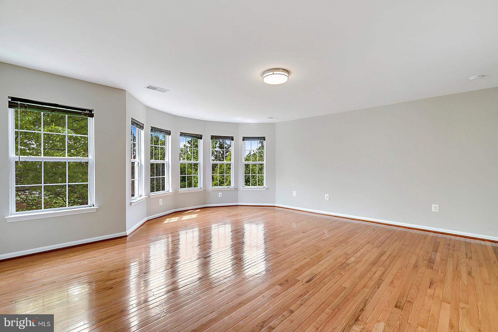 4175 Bell Ridge Court Chantilly, VA 20151 - Photo 24 of 48 a view of an empty room with wooden floor and a window